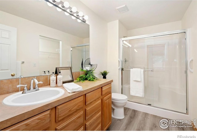 4603 Dusty Sage Ct Unit 4, Fort Collins, CO 80526 - bathroom featuring wood finished floors, a stall shower, vanity, and toilet
