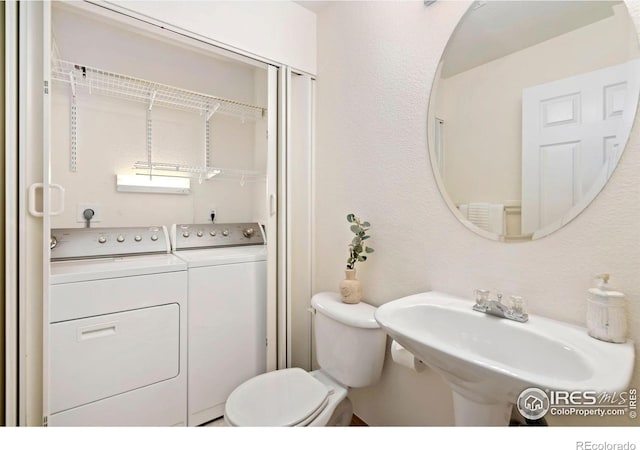 4603 Dusty Sage Ct Unit 4, Fort Collins, CO 80526 - half bathroom featuring washer and dryer, a sink, and toilet