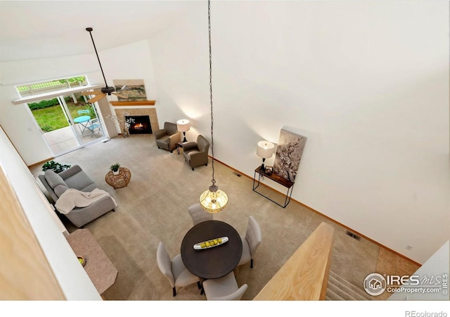 4603 Dusty Sage Ct Unit 4, Fort Collins, CO 80526 - living room with carpet floors, baseboards, high vaulted ceiling, and a fireplace