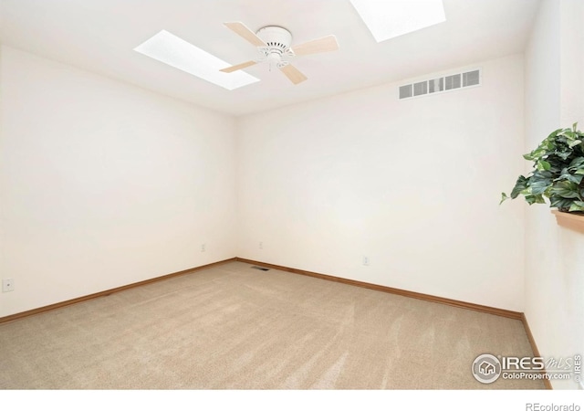4603 Dusty Sage Ct Unit 4, Fort Collins, CO 80526 - empty room featuring a skylight, carpet, baseboards, and ceiling fan