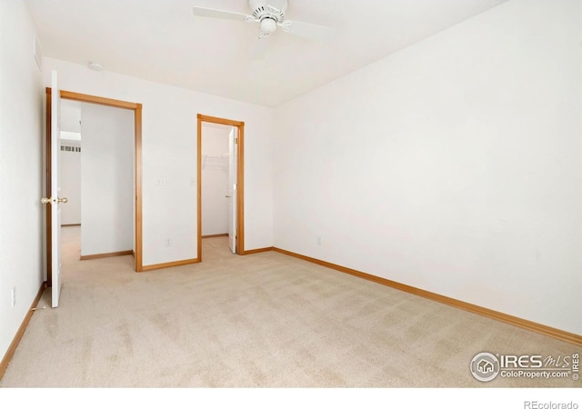 4603 Dusty Sage Ct Unit 4, Fort Collins, CO 80526 - unfurnished bedroom featuring carpet floors, baseboards, a walk in closet, a ceiling fan, and a closet