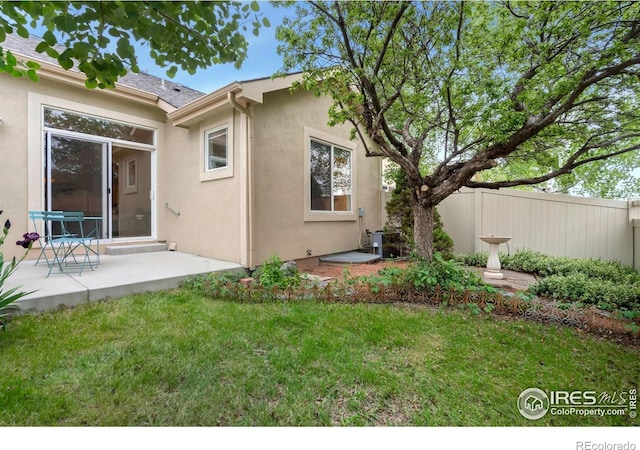 4603 Dusty Sage Ct Unit 4, Fort Collins, CO 80526 - rear view of house featuring stucco siding and a patio area