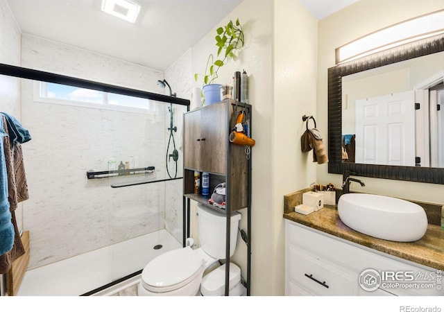 5196 32nd St, Greeley, CO 80634 - full bath featuring a walk in shower, toilet, and vanity