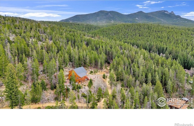 65 La Chula Rd, Black Hawk, CO 80422 - view of subject property with a heavily wooded area and mountains