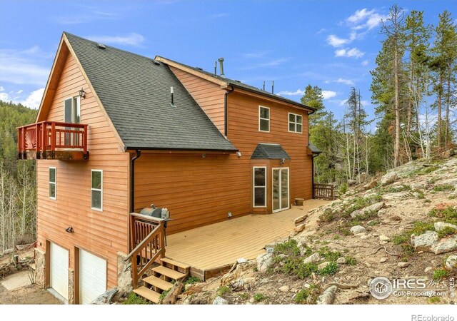 65 La Chula Rd, Black Hawk, CO 80422 - back of house with a deck, a garage, a shingled roof, french doors, and a balcony