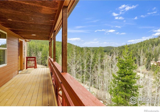 65 La Chula Rd, Black Hawk, CO 80422 - wooden terrace featuring a view of trees