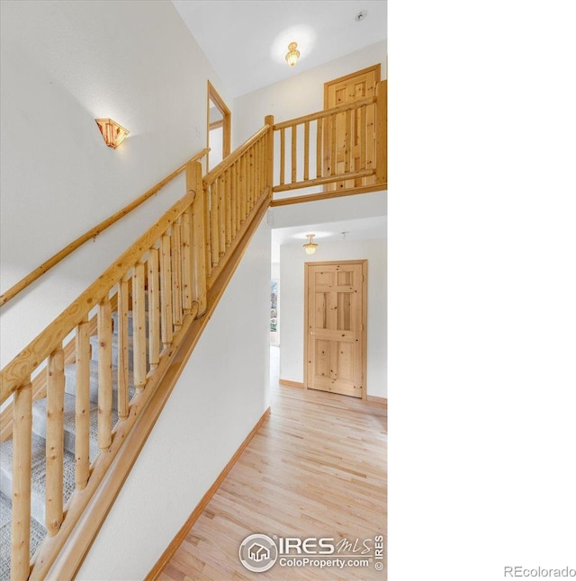 65 La Chula Rd, Black Hawk, CO 80422 - staircase with wood finished floors and baseboards