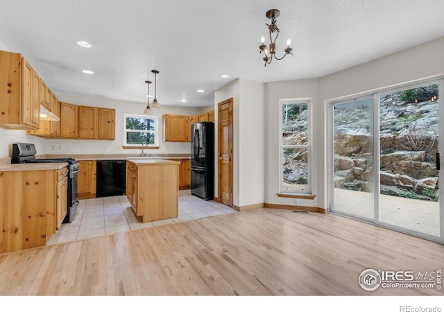 65 La Chula Rd, Black Hawk, CO 80422 - kitchen featuring black appliances, under cabinet range hood, light wood finished floors, light countertops, and recessed lighting