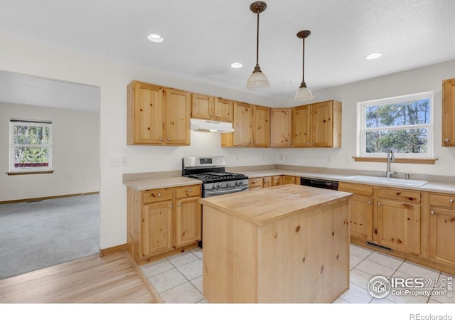 65 La Chula Rd, Black Hawk, CO 80422 - kitchen featuring stainless steel gas stove, a sink, under cabinet range hood, butcher block counters, and plenty of natural light