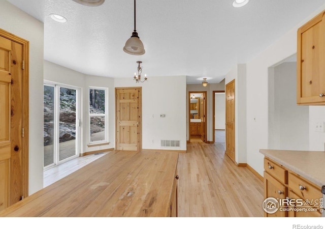 65 La Chula Rd, Black Hawk, CO 80422 - unfurnished dining area with baseboards, light wood-style flooring, a chandelier, and recessed lighting