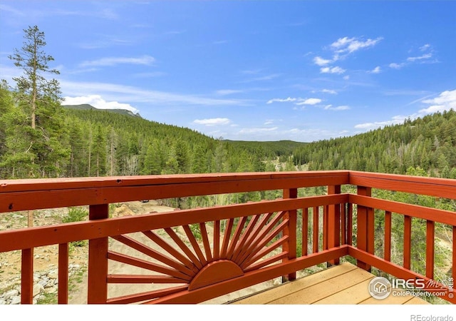 65 La Chula Rd, Black Hawk, CO 80422 - wooden terrace featuring a view of trees and a mountain view