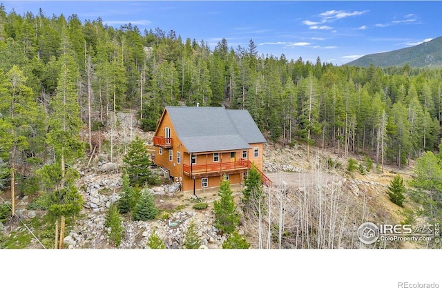 65 La Chula Rd, Black Hawk, CO 80422 - view of subject property featuring a forest and mountains