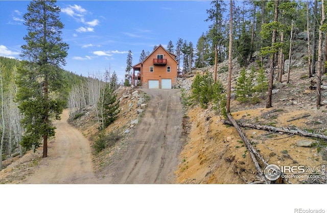 65 La Chula Rd, Black Hawk, CO 80422 - rustic home featuring dirt driveway and a garage