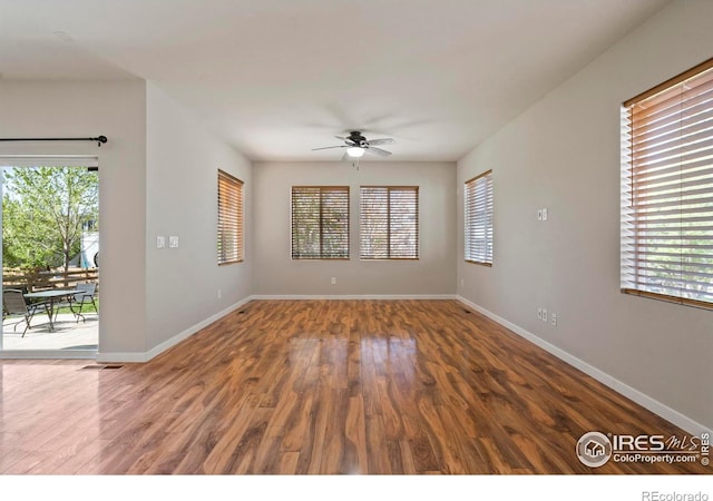 10069 Richfield St, Commerce City, CO 80022 - empty room with a ceiling fan, wood finished floors, and baseboards