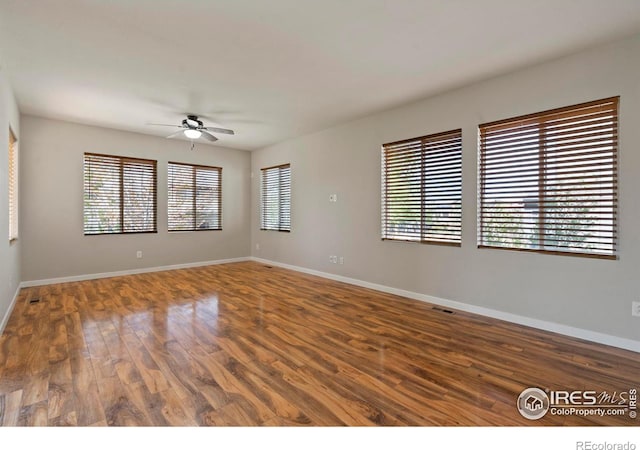 10069 Richfield St, Commerce City, CO 80022 - empty room with a ceiling fan, wood finished floors, and baseboards
