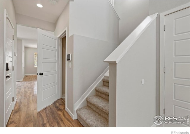 10069 Richfield St, Commerce City, CO 80022 - staircase with wood finished floors, baseboards, and recessed lighting