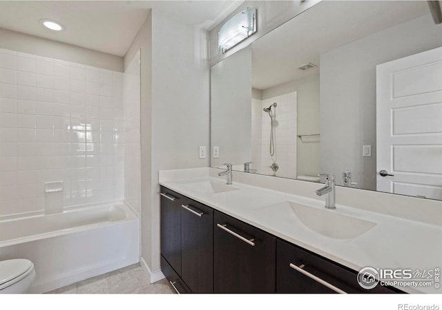 10069 Richfield St, Commerce City, CO 80022 - full bath with toilet, shower / tub combination, double vanity, recessed lighting, and tile patterned floors