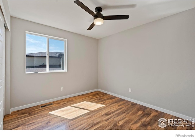 10069 Richfield St, Commerce City, CO 80022 - unfurnished room featuring ceiling fan, baseboards, and wood finished floors