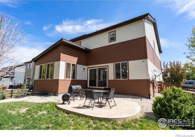 10069 Richfield St, Commerce City, CO 80022 - rear view of house with a patio and fence