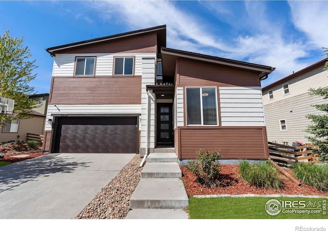 10069 Richfield St, Commerce City, CO 80022 - modern home with fence, an attached garage, and concrete driveway