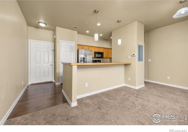 kitchen with stainless steel refrigerator with ice dispenser, dark carpet, black microwave, baseboards, and recessed lighting
