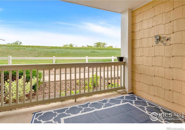 balcony featuring a rural view
