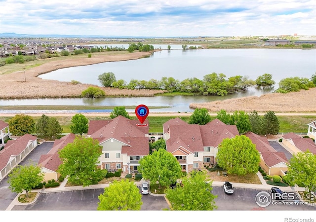 aerial view of residential area with a large body of water