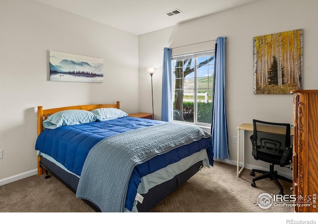 carpeted bedroom with baseboards