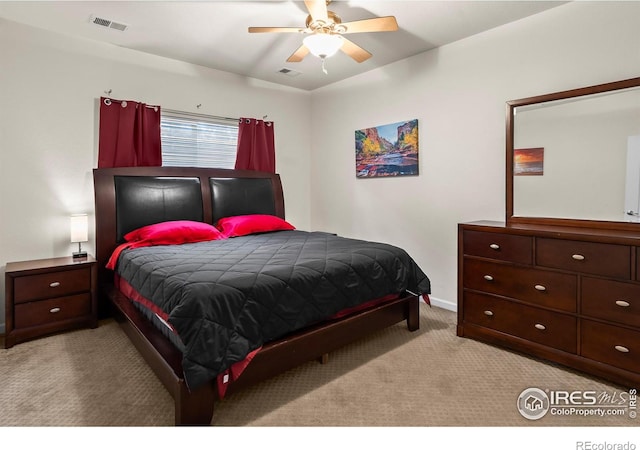 bedroom with carpet, baseboards, and a ceiling fan