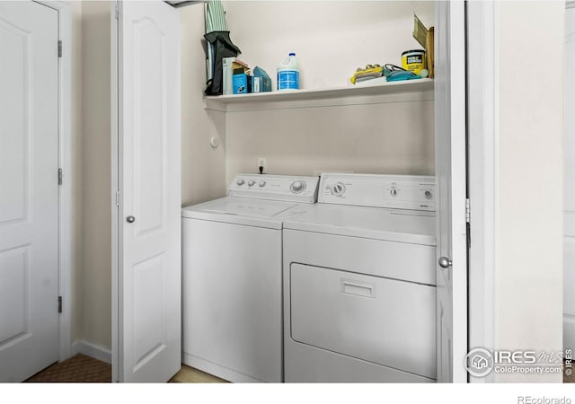 laundry area with washing machine and clothes dryer
