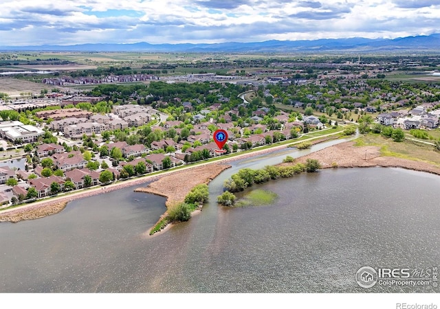 drone / aerial view of a water and mountain view