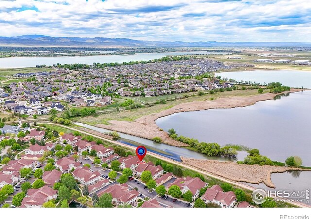 aerial view of residential area with a water and mountain view