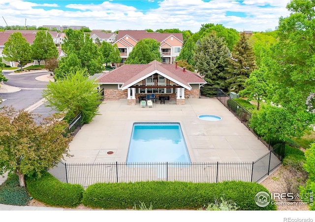 view of swimming pool featuring a fenced backyard and a patio