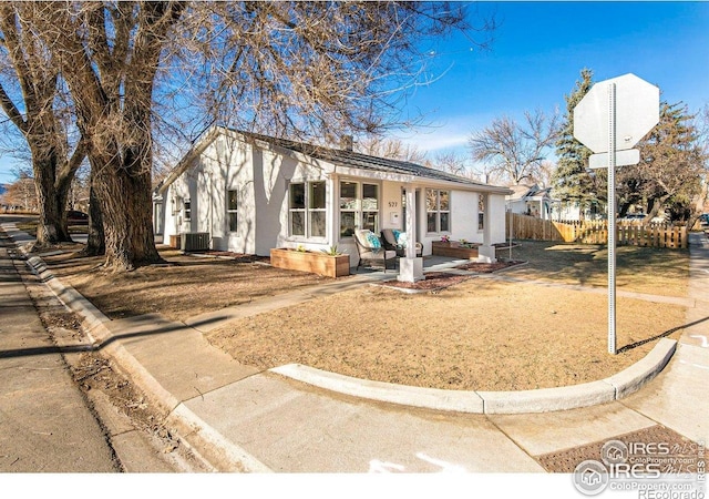 527 S Bryan Ave, Fort Collins, CO 80521 - ranch-style home with fence, stucco siding, cooling unit, and a patio area
