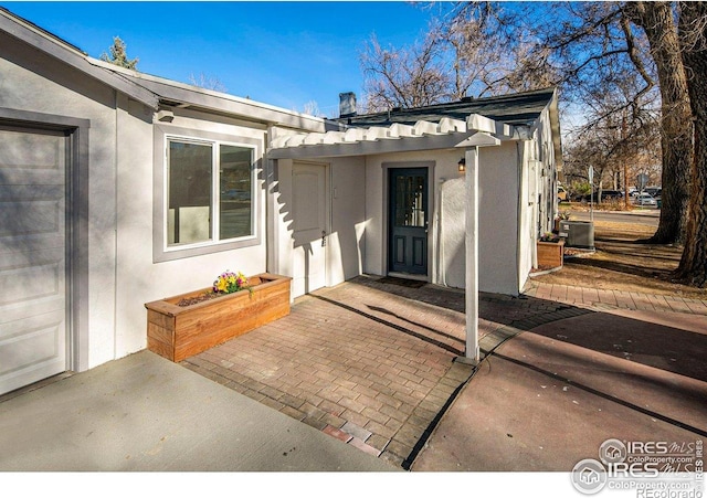 527 S Bryan Ave, Fort Collins, CO 80521 - entrance to property with stucco siding and cooling unit