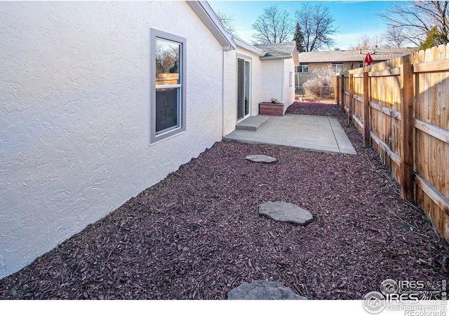 527 S Bryan Ave, Fort Collins, CO 80521 - fenced backyard featuring a patio