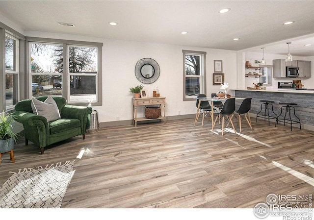 527 S Bryan Ave, Fort Collins, CO 80521 - living area with light wood-style floors, recessed lighting, and baseboards