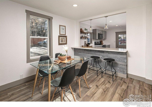 527 S Bryan Ave, Fort Collins, CO 80521 - dining room with wood finished floors, recessed lighting, baseboards, and plenty of natural light