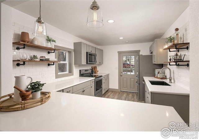 527 S Bryan Ave, Fort Collins, CO 80521 - kitchen with stainless steel appliances, a sink, gray cabinetry, open shelves, and recessed lighting