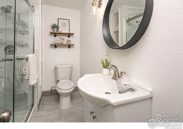 527 S Bryan Ave, Fort Collins, CO 80521 - full bath with a shower stall, vanity, toilet, and a textured wall