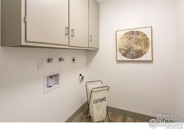 527 S Bryan Ave, Fort Collins, CO 80521 - washroom featuring cabinet space, hookup for a washing machine, hookup for a gas dryer, and electric dryer hookup