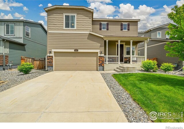 6008 Sandstone Cir, Frederick, CO 80516 - view of front of house featuring a porch, an attached garage, and concrete driveway