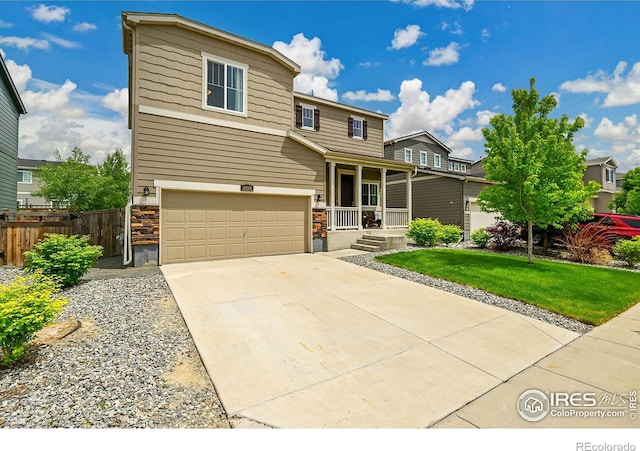 6008 Sandstone Cir, Frederick, CO 80516 - view of front facade with covered porch, an attached garage, and driveway