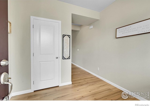 6008 Sandstone Cir, Frederick, CO 80516 - corridor featuring light wood-style flooring and baseboards