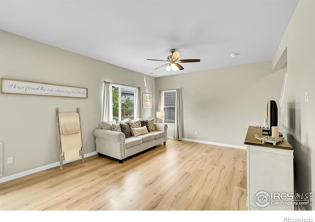 6008 Sandstone Cir, Frederick, CO 80516 - living room featuring light wood finished floors, ceiling fan, and baseboards