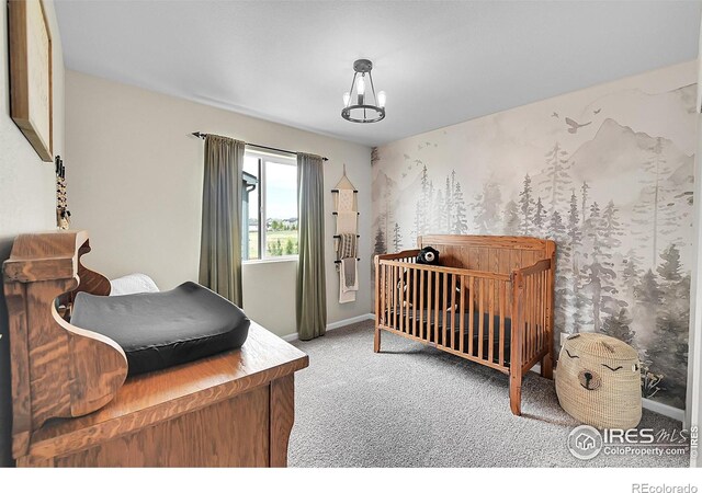 6008 Sandstone Cir, Frederick, CO 80516 - bedroom featuring carpet flooring, baseboards, and a chandelier