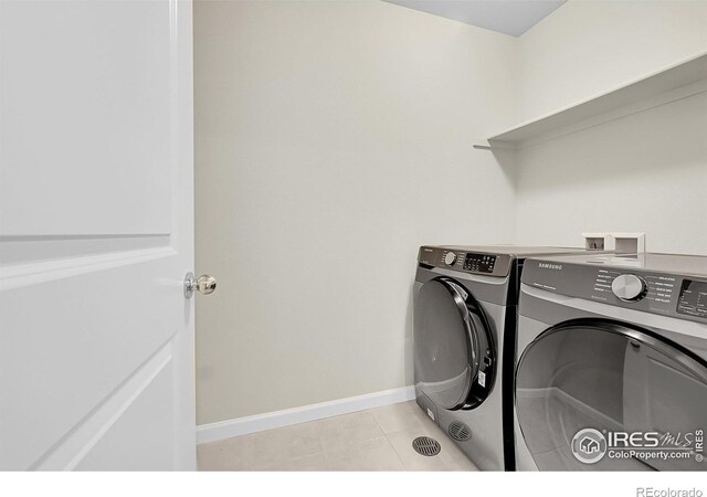 6008 Sandstone Cir, Frederick, CO 80516 - washroom with independent washer and dryer, baseboards, and light tile patterned floors