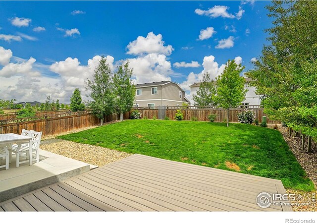 6008 Sandstone Cir, Frederick, CO 80516 - wooden deck with a patio