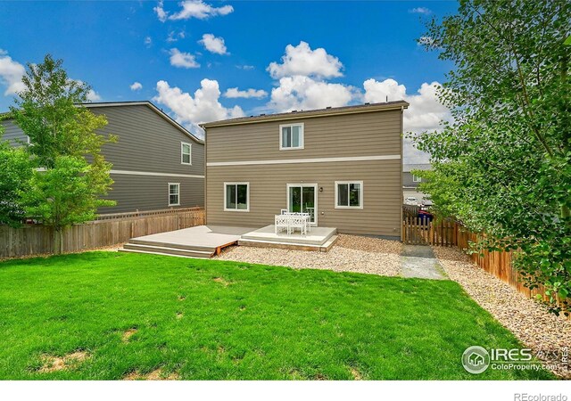 6008 Sandstone Cir, Frederick, CO 80516 - back of property with a deck