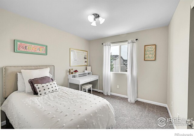 6008 Sandstone Cir, Frederick, CO 80516 - carpeted bedroom featuring baseboards